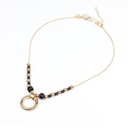 Collar Dorado y Negro con Dije Circular